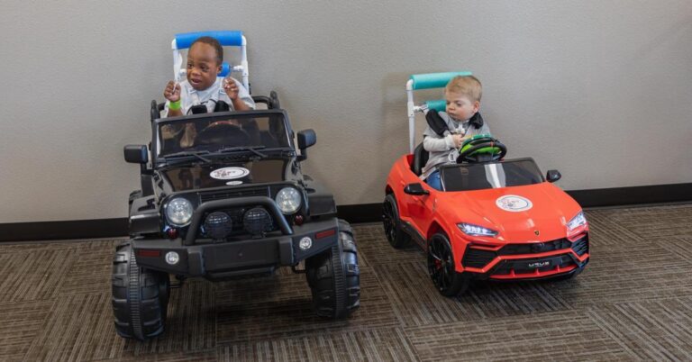 Isaac and Levon in their vehicles